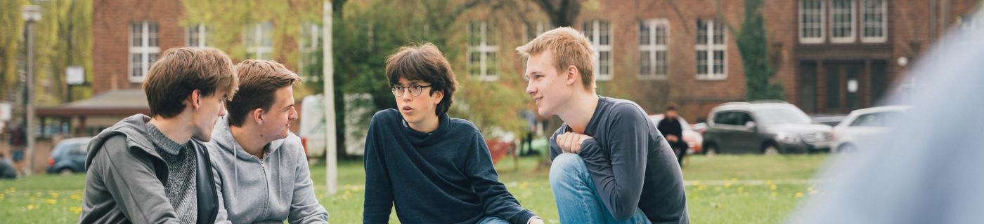 People sitting on gras